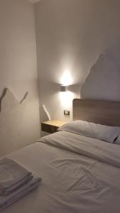 Postel nebo postele na pokoji v ubytování Manuel Guesthouse Ravascletto