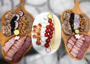 a group of plates of food on wooden spoons at Voinescu House - Natural Living & Eating in Şimon