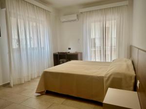 Posteľ alebo postele v izbe v ubytovaní Hotel Soleado
