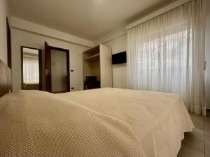 Posteľ alebo postele v izbe v ubytovaní Hotel Soleado