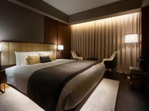 Postel nebo postele na pokoji v ubytování Mitsui Garden Hotel Roppongi Tokyo Premier
