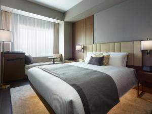 Postel nebo postele na pokoji v ubytování Mitsui Garden Hotel Roppongi Tokyo Premier