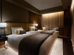 Postel nebo postele na pokoji v ubytování Mitsui Garden Hotel Roppongi Tokyo Premier