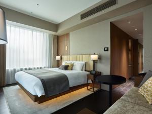 Postel nebo postele na pokoji v ubytování Mitsui Garden Hotel Roppongi Tokyo Premier