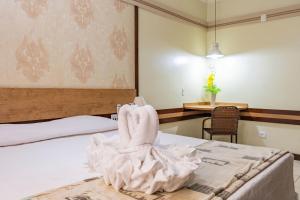 Cama ou camas em um quarto em Hotel Colonial Iguaçu