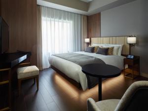 Postel nebo postele na pokoji v ubytování Mitsui Garden Hotel Roppongi Tokyo Premier
