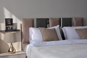 Ένα ή περισσότερα κρεβάτια σε δωμάτιο στο Axxodia- Apartments In Aeon Towers