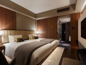 Postel nebo postele na pokoji v ubytování Mitsui Garden Hotel Roppongi Tokyo Premier
