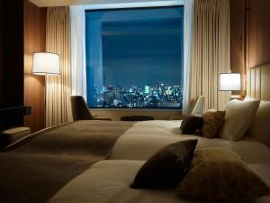 Postel nebo postele na pokoji v ubytování Mitsui Garden Hotel Roppongi Tokyo Premier