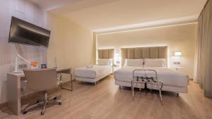 Ein Bett oder Betten in einem Zimmer der Unterkunft Hesperia Murcia Centro