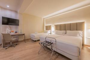 Ein Bett oder Betten in einem Zimmer der Unterkunft Hesperia Murcia Centro