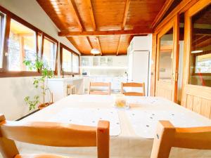 a kitchen and dining room with a table and chairs at Tirana Experience, Authentic Stays in the Heart of Old Tirana in Tirana