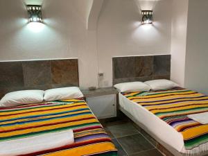 Postel nebo postele na pokoji v ubytování hotel las olas zicatela + 17 fotografií
