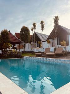 Bazén v ubytování Bukit Catu Bungalows nebo v jeho okolí