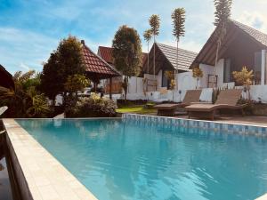 Bazén v ubytování Bukit Catu Bungalows nebo v jeho okolí