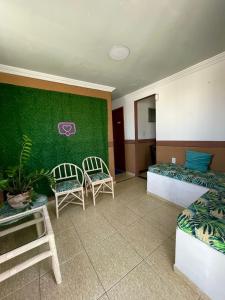 Cama ou camas em um quarto em Pousada Bellmar - Praia Peró 5 min andando