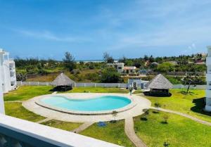 an image of a swimming pool on a resort at Modern Couzy Suites in Malindi