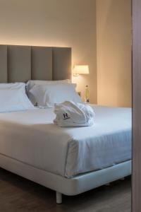 Ein Bett oder Betten in einem Zimmer der Unterkunft Hesperia Murcia Centro