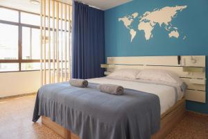 Ένα ή περισσότερα κρεβάτια σε δωμάτιο στο Atlantic Suite Playa San Juan