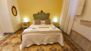 A bed or beds in a room at Boutique Rooms and Breakfast GranVeliero