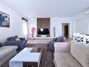 Posezení v ubytování Axxodia- Apartments In Mivida Lake District