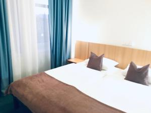 Katil atau katil-katil dalam bilik di Penzion Hotelu Central