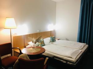 Katil atau katil-katil dalam bilik di Penzion Hotelu Central
