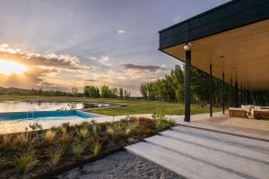 a house with a swimming pool and a patio at House by Casa Septem in Tupungato