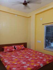 Postel nebo postele na pokoji v ubytování Rukmini Guest House