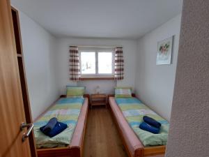 Postel nebo postele na pokoji v ubytování Haus am See