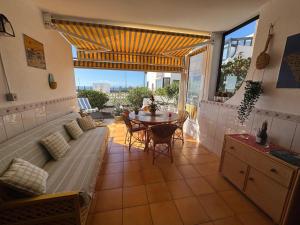 a living room with a couch and a table at VILLA SISSI Atlantic View in Costa Del Silencio