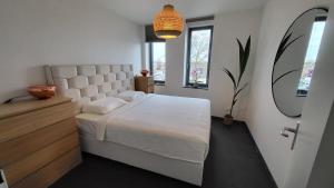 Ένα ή περισσότερα κρεβάτια σε δωμάτιο στο B&B Kopwest 1