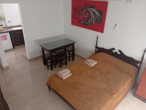 En eller flere senge i et værelse på Lo de Cheo