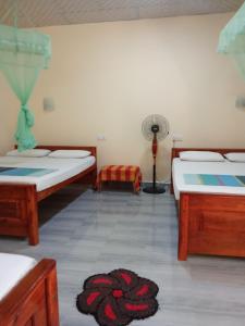 Katil atau katil-katil dalam bilik di Udesh Guest
