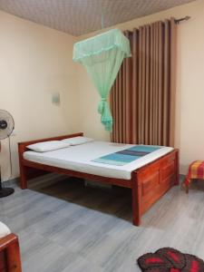 Katil atau katil-katil dalam bilik di Udesh Guest