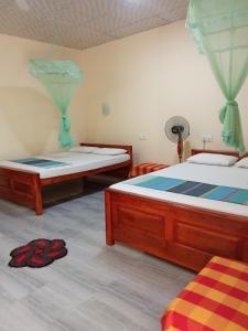 Katil atau katil-katil dalam bilik di Udesh Guest