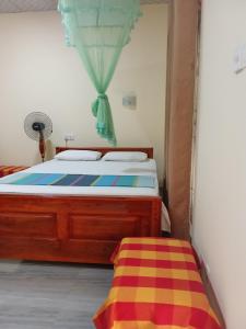 Katil atau katil-katil dalam bilik di Udesh Guest