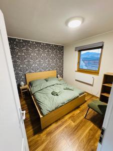 En eller flere senge i et værelse på Holiday House Brezno