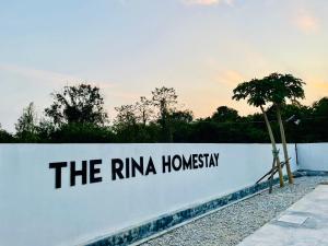 a white wall with the riniha homani written on it at The Rina Homestay-Whole Villa with Private Pool,BBQ & Karaoke-1Min Beach- in Port Dickson