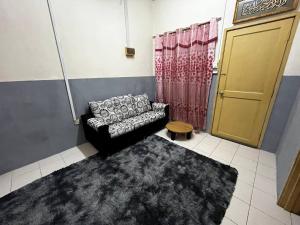 Istumisnurk majutusasutuses Homestay Seri Aishah