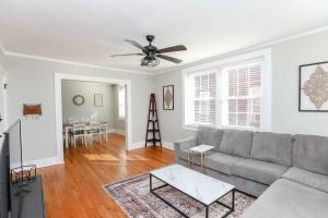 a living room with a couch and a ceiling fan at Sojourn at Colley Manor Unit 6 in Norfolk