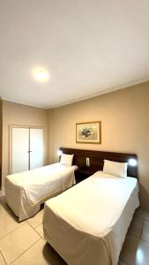 Postel nebo postele na pokoji v ubytování HOTEL DEL REY CURITIBA by POTY - NA FAMOSA RUA XV DE NOVEMBRO + 37 fotografií