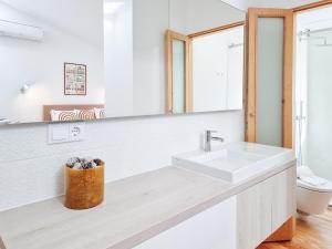 a bathroom with a sink and a mirror at Style in a pedestrian quarter in the city's heart in Porto +34 photos