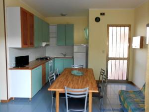 Kuchyň nebo kuchyňský kout v ubytování Federica + 28 fotografií