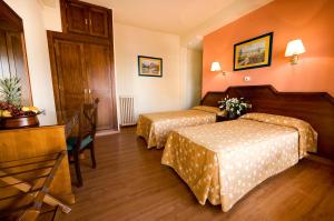 Postel nebo postele na pokoji v ubytování Hotel Monarque Cendrillón