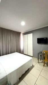 Postel nebo postele na pokoji v ubytování HOTEL DEL REY CURITIBA by POTY - NA FAMOSA RUA XV DE NOVEMBRO