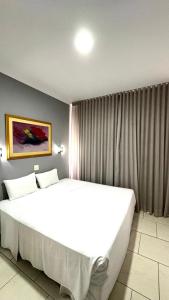 Postel nebo postele na pokoji v ubytování HOTEL DEL REY CURITIBA by POTY - NA FAMOSA RUA XV DE NOVEMBRO