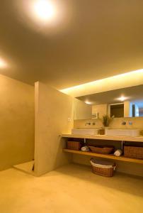 a bathroom with a sink and a mirror at YES! Incrível Vista Piscina T2 HsR Vilamarina in Vilamoura +20 photos