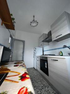 Kuchyň nebo kuchyňský kout v ubytování Dilman appartamento + 13 fotografií