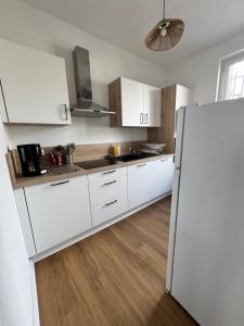 Nhà bếp/bếp nhỏ tại Le Nid des Saveurs +3 ảnh